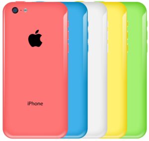 iPhones in various colors, including a bright peach